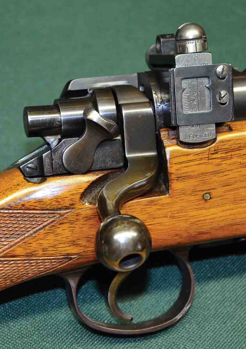 The Model 30 inherited its dogleg bolt handle and two-position safety from the 1917 Enfield. Protrusion of the cocking piece from the rear of the bolt shroud indicates the firing pin is cocked.